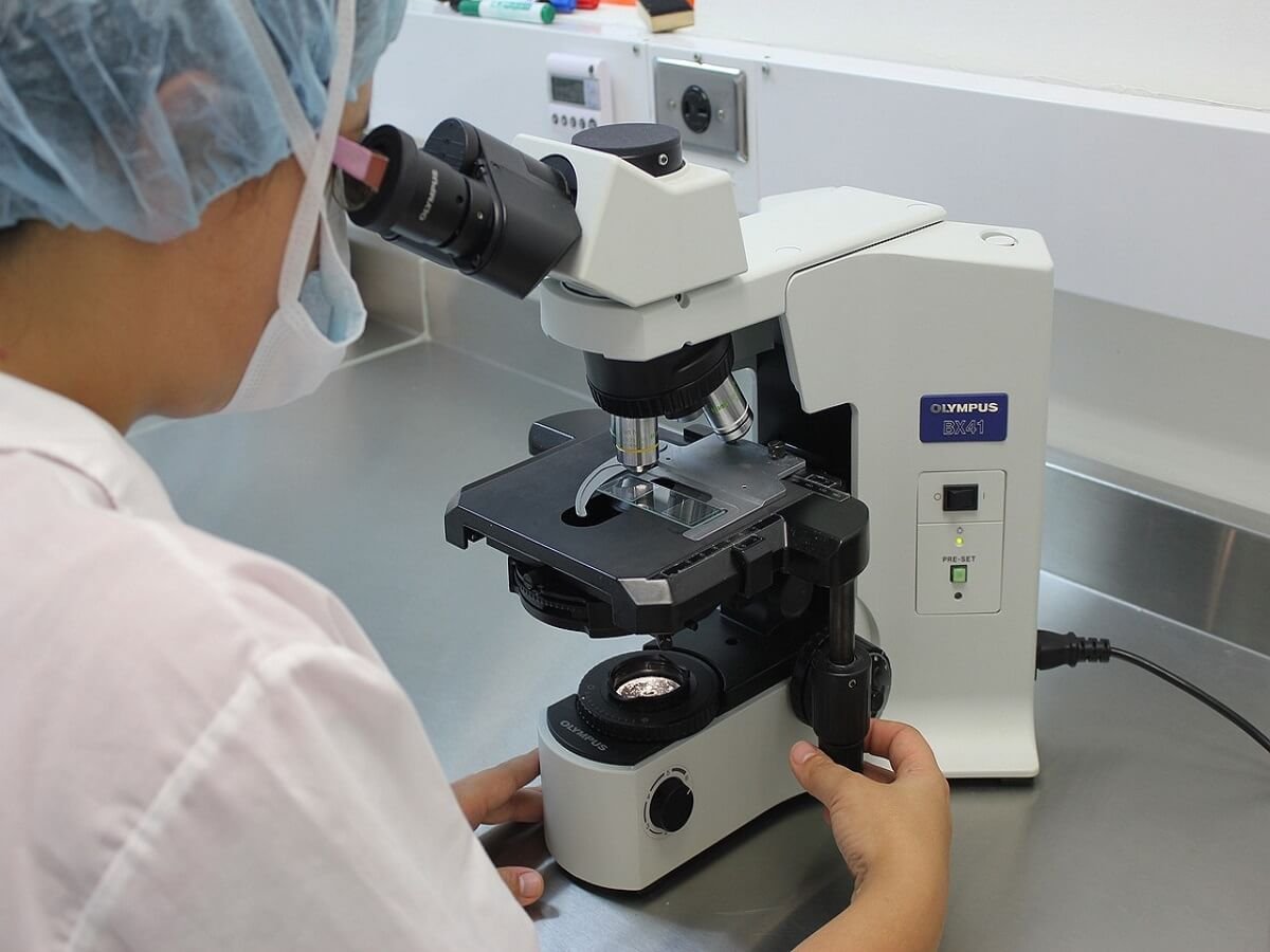 Person using a microscope